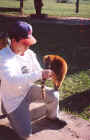 Tour guide Rizardo playing with a South American Coati