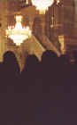 Women praying inside the mosque, the minbar (pulpit) visible above their heads. Muslim women are required to wear the black robe inside a mosque which can also be borrowed at the entrance 